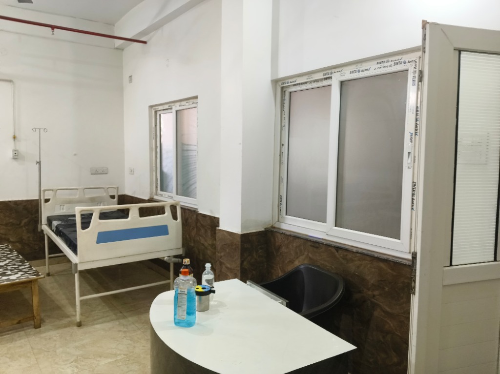 General Ward Life Care Hospital Robertsganj — Clean Patient Room with Nursing Station